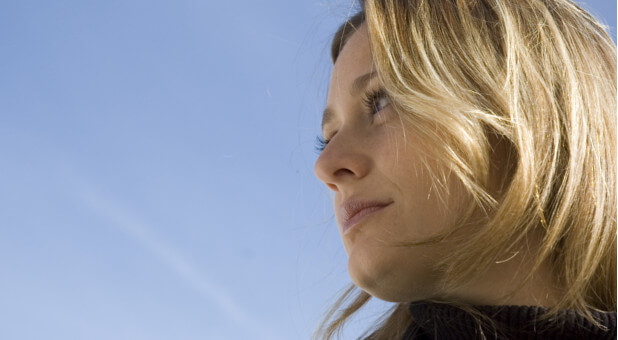 woman looking up at sky