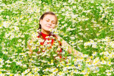 woman-joyful-flower-field