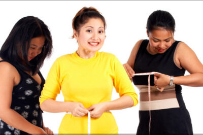three woman measuring themselves