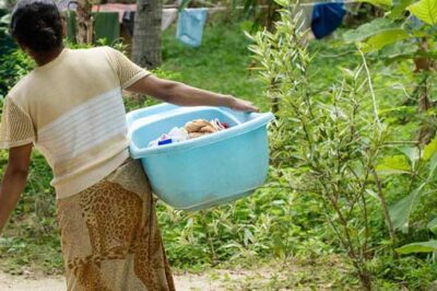 Indian woman carrying laundry