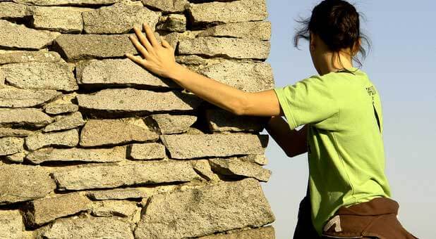 woman climbing mountain