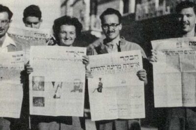 Zippy (Borowsky) Porath and other American students in Jerusalem holding newspapers (Nov. 30, 1947) announcing the UN vote on the Partition Plan for Palestine, approving a Jewish State