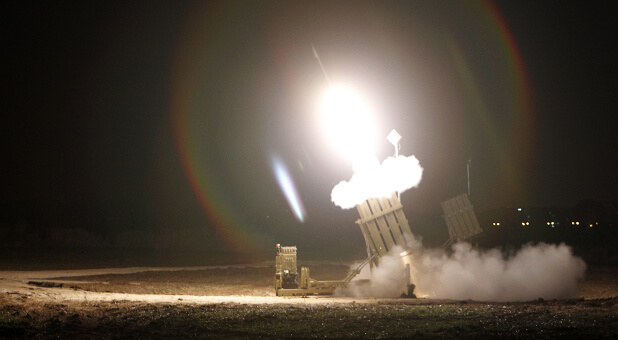 An Iron Dome launcher firing an interceptor rocket