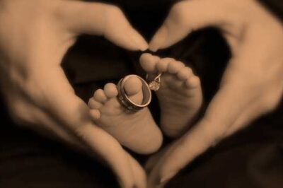 Heart surrounding baby feet