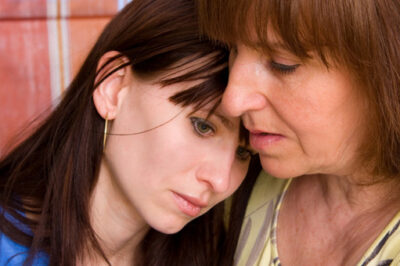 older woman showing compassion to younger woman