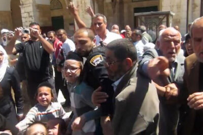 Israeli police attempt to protect Jews from angry Arabs in an incident recently at the Temple Mount in Jerusalem.