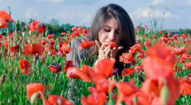 Woman smelling flowers