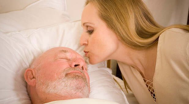 woman kissing man in hospital