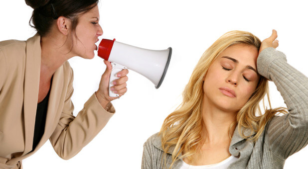 woman with megaphone screaming at another woman