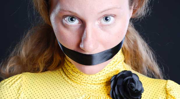 woman muzzled by tape