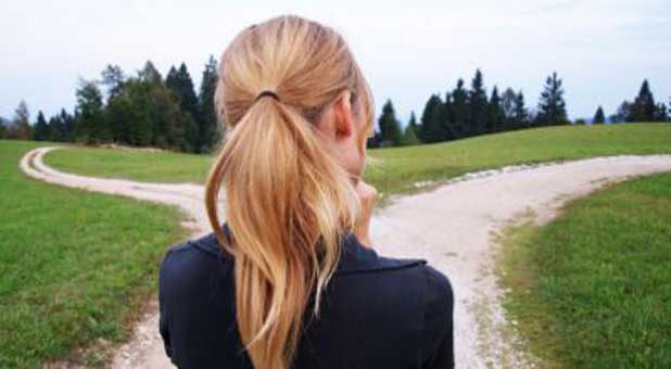 woman in front of 2 roads