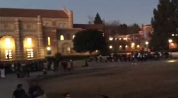 Muslims praying on an athletic field at UCLA