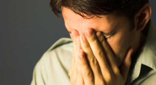 man praying desparately