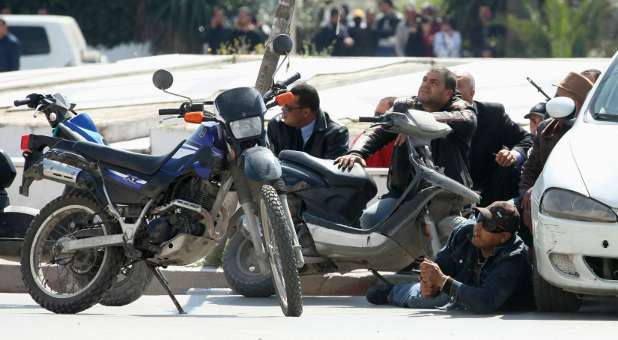 Police officers outside parliament on Tunisia.