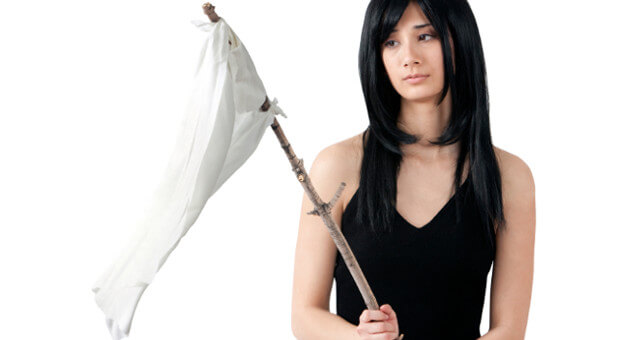 woman holding flag to surrender