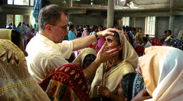 Lee Grady, founder of The Mordecai Project, ministers a group of women in India.