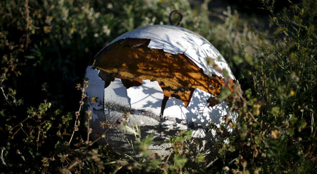 A dried out buoy is seen where the water receded in a California lake.