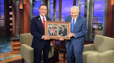 Steve Strang presented CBN's Pat Robertson with a momento for being part of Charisma's 40