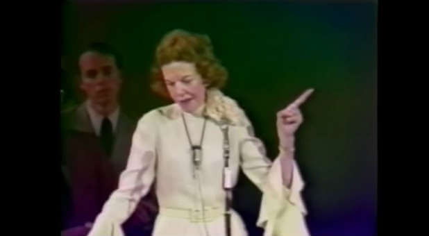 Kathryn Kuhlman preaches a message.