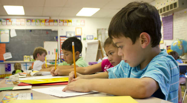 E. Ray Moore believes Christians should remove their kids from public schools.