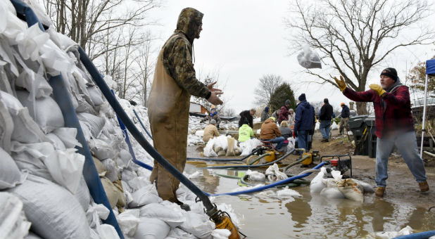Volunteers assist after historic flooding.