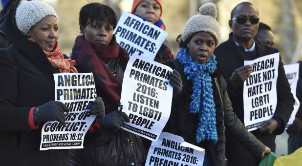 Christian LGBT advocates protest against the Anglican Communion's sanctions.