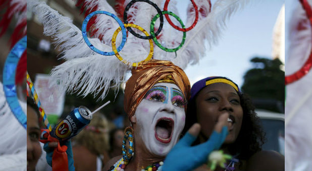 A reveller poses for a selfie as he takes part in the annual block party known as the