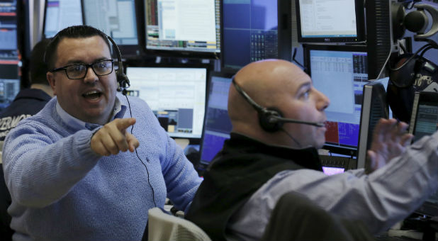 Traders work on the floor of the New York Stock Exchange.
