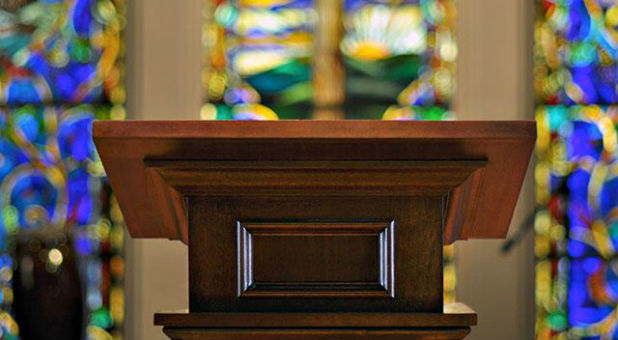 The police found the pastor dead from lethal stab wounds and his son Isaiah covered in blood nearby.