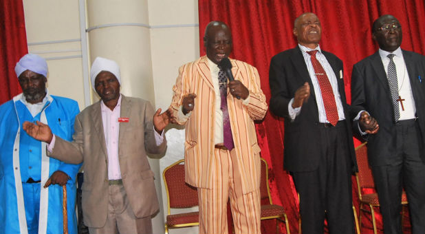 Senior leaders of evangelical churches in Kenya pray at a meeting called to protest laws regulating the country's churches in January 2016.