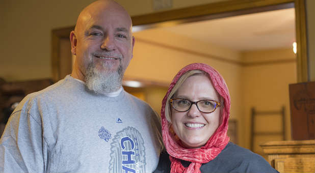 Mike and Martha DeVries pose for a photograph in their home in North Kansas City, Missouri.