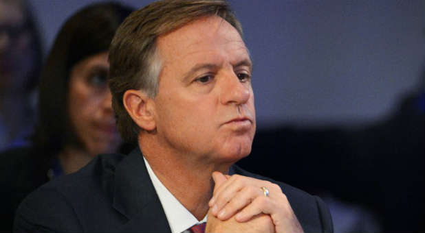 Tennessee Republican Governor Bill Haslam listens.