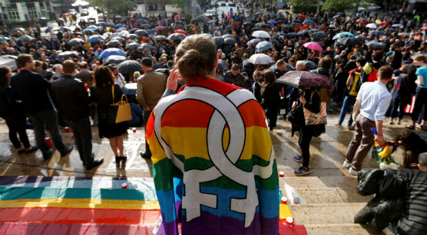People in central Brussels attend a vigil in memory of the victims of the gay nightclub mass shooting in Orlando.