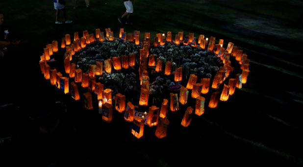 Candles are pictured on the ground during a vigil for the Pulse night club victims following last week's shooting in Orlando