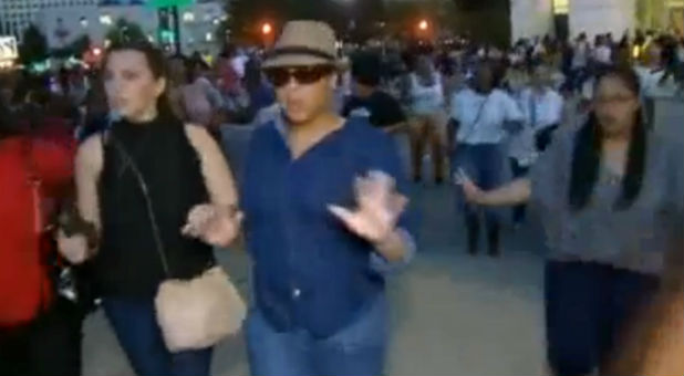 Protesters escape when shots are fired at a Dallas march.