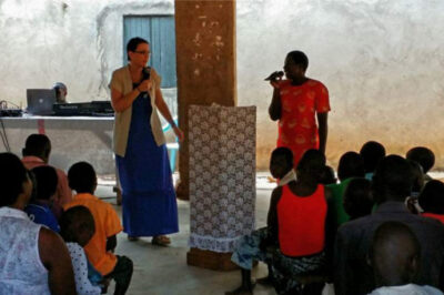 Karen preaches at a church in Uganda.