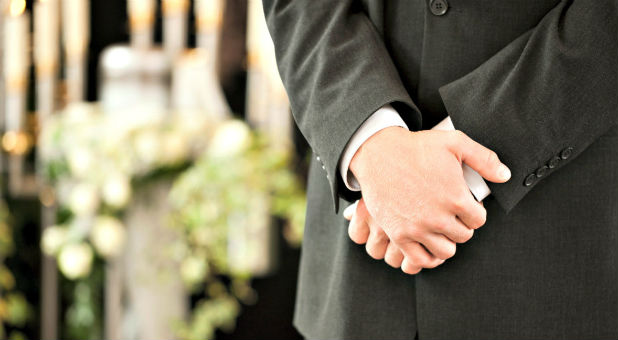 The owner of three Michigan funeral homes is defending his right to require employees to dress on the job according to their biological sex, in a federal case brought on behalf of a transgender woman who used to work as a funeral director.