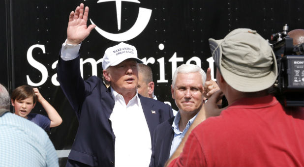 Republican presidential nominee Donald Trump and Republican U.S. vice presidential candidate Mike Pence speak with flood victims outside Greenwell Springs Baptist Church in Central, Louisiana