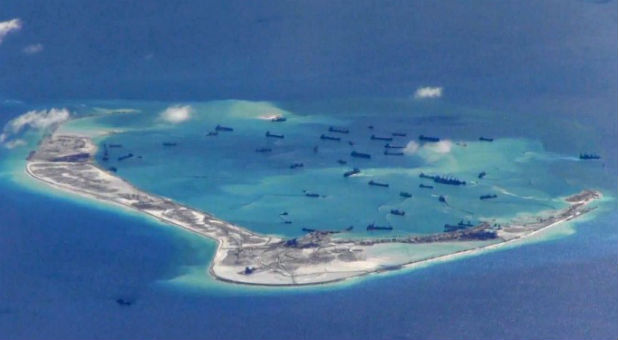 Chinese dredging vessels are purportedly seen in the waters around Mischief Reef in the disputed Spratly Islands in the South China Sea