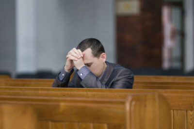 Man praying church