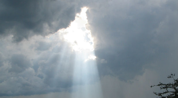 Sun shines through clouds