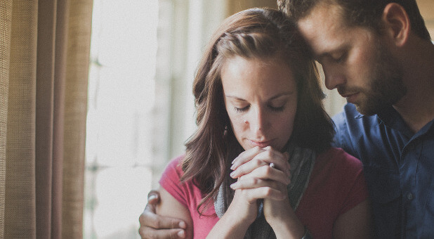 Husband and wife praying