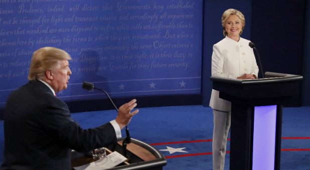 Republican U.S. presidential nominee Donald Trump speaks as Democratic U.S. presidential nominee Hillary Clinton listens during their third and final 2016 presidential campaign debate at UNLV in Las Vegas, Nevada.