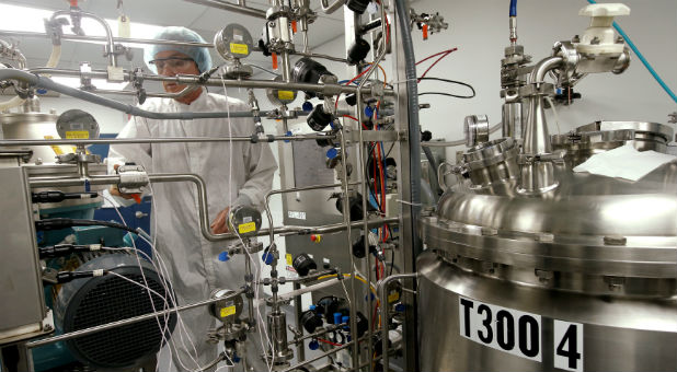 Lead Protein Production and Centrifugation scientist Paul Koelle operates a centrifuge control panel where they are working on developing a vaccine for the Zika virus based on production of recombinant variations of the E protein from the Zika virus at the Protein Sciences Inc. headquarters
