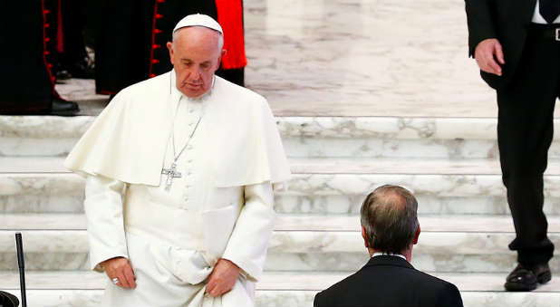 Pope Francis leaves at the end of a Jubilee audience with people socially excluded in Paul VI hall at the Vatican.