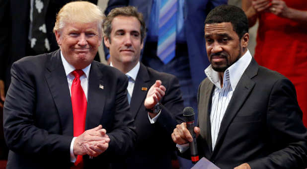 Republican presidential nominee Donald Trump (l) answers questions from pastor Darrell Scott at the New Spirit Revival Center in Cleveland Heights, Ohio, in September.