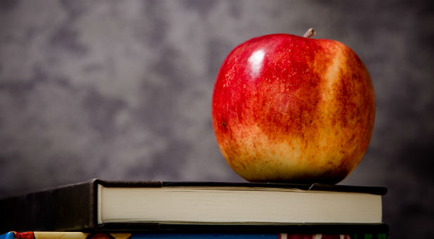 A Florida teacher claims her Christian students bully by how they practice their faith.