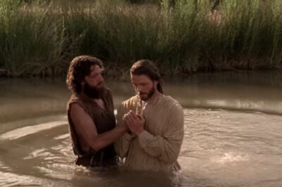John the Baptist baptizes Jesus in the Jordan River.