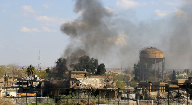 Smoke rises from from the old city during a battle against Islamic State militants, in Mosul, Iraq.