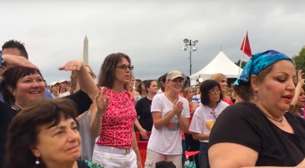 People worship on the National Mall.